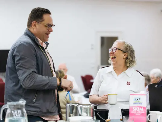 Salvos officer having coffee and interacting