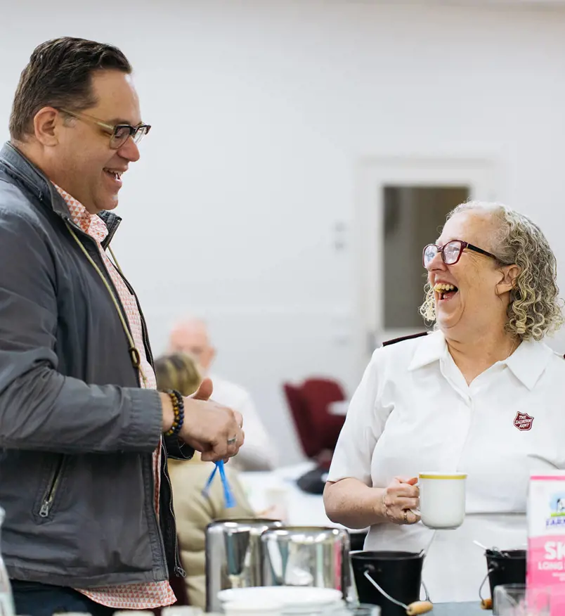 Salvos officer having coffee and interacting