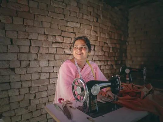 Woman at a sewing machine