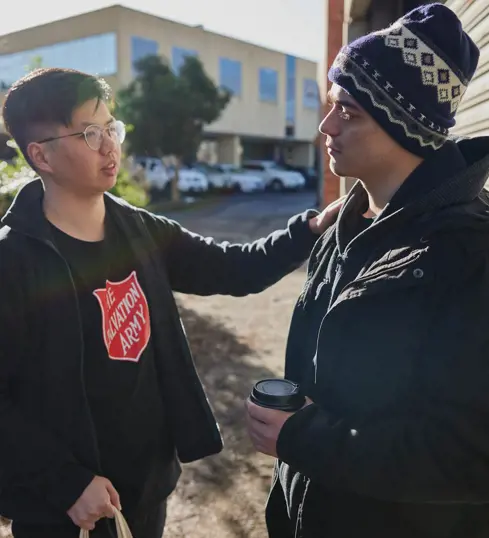 Salvos team member helping an individual