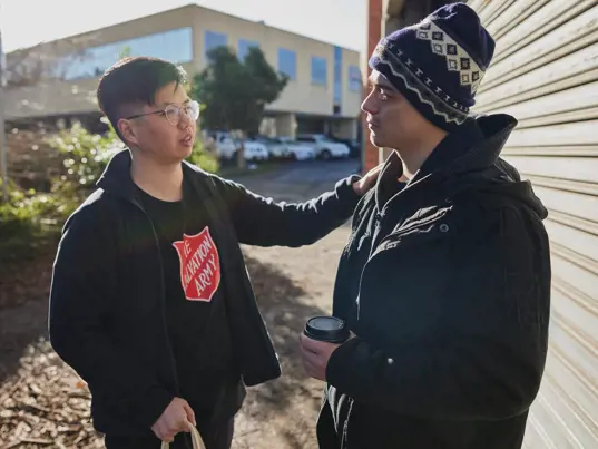 Salvos team member helping an individual