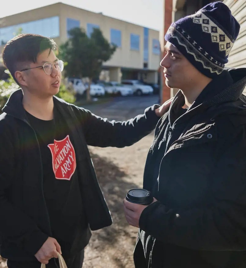 Salvos team member helping an individual