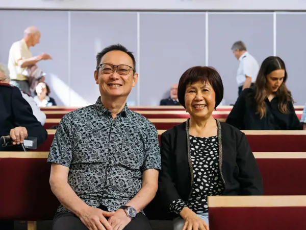 Community members seated at a service