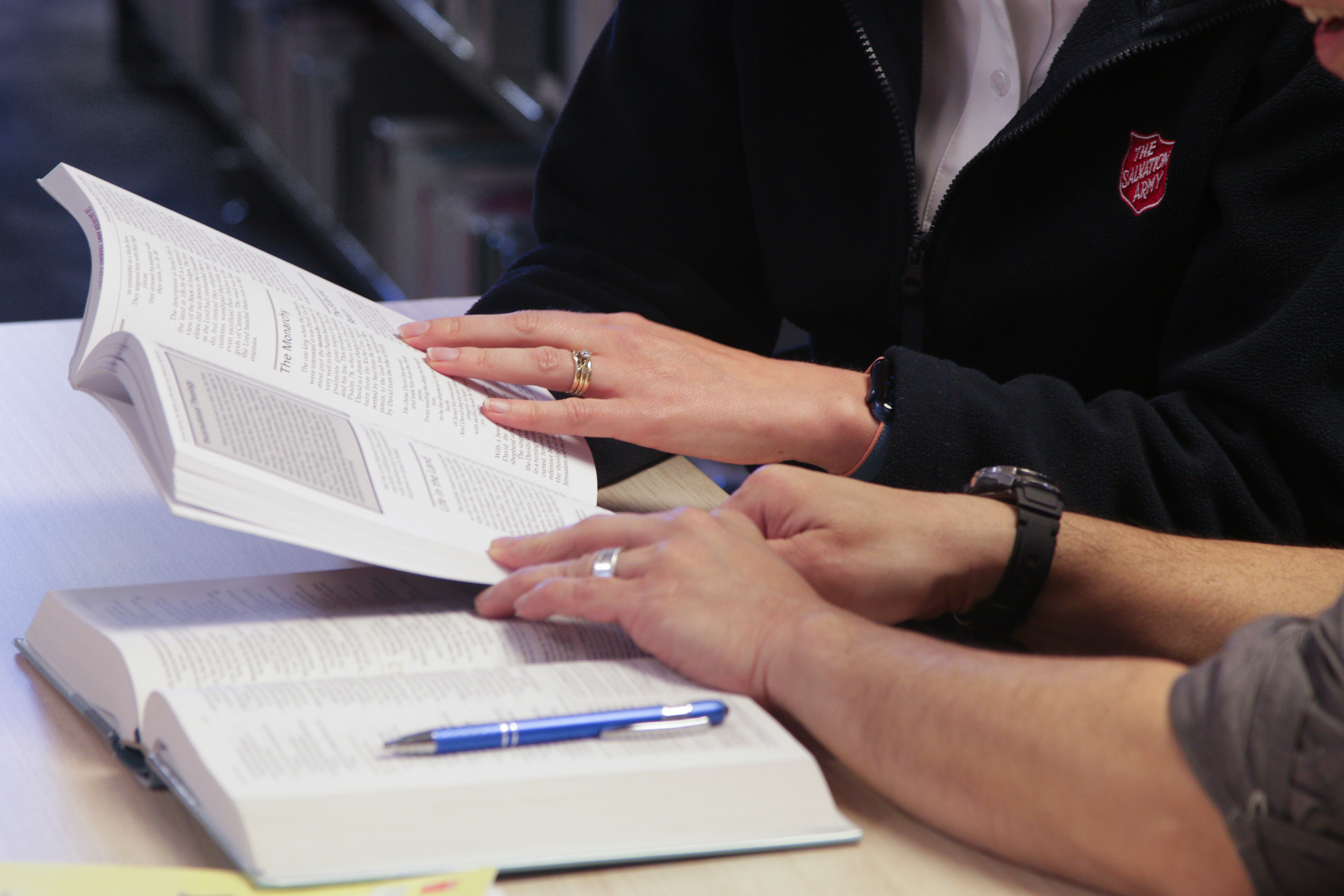 Two people studying with their bibles