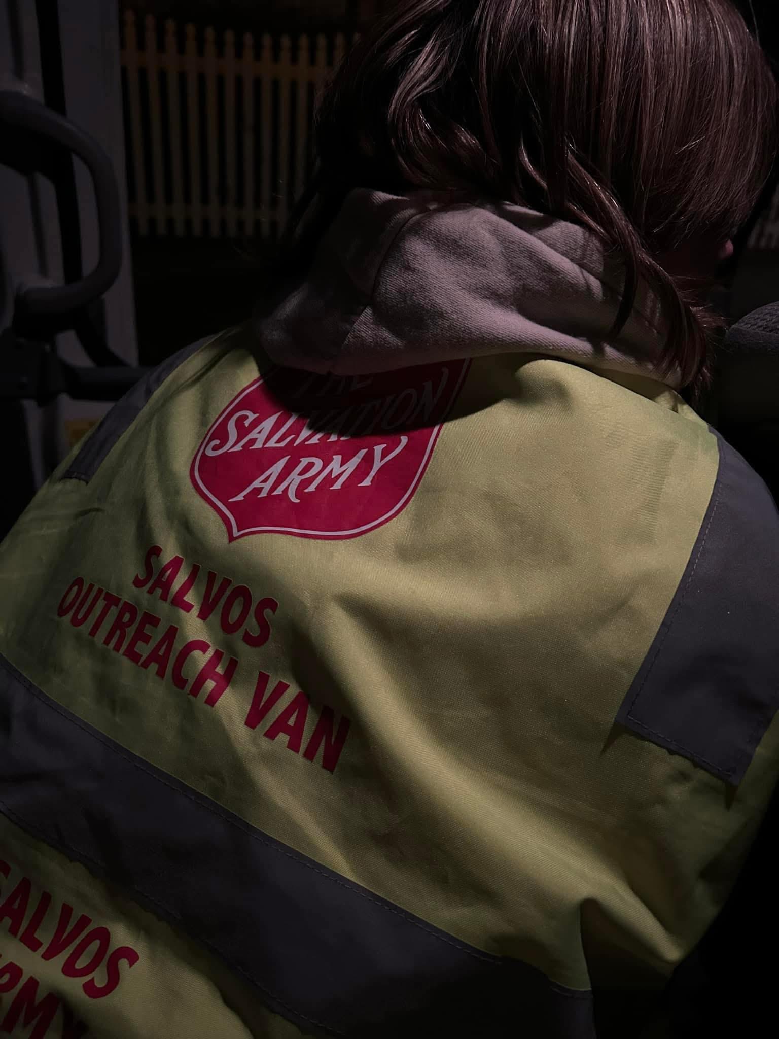 A volunteer with the Salvos at the Bellarine Peninsula - the back of their vest showing.