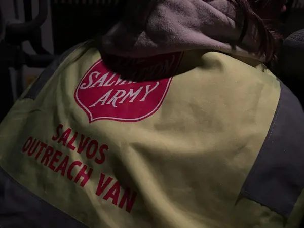 A volunteer with the Salvos at the Bellarine Peninsula - the back of their vest showing.