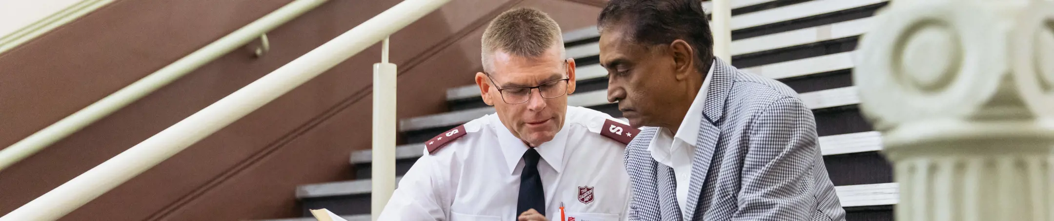 Chaplain talking to elderly person
