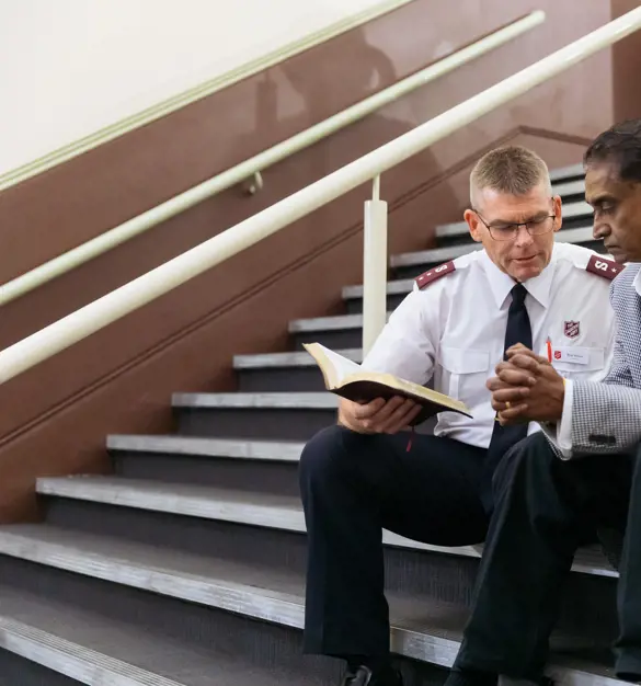Chaplain talking to elderly person