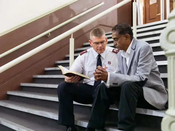 Chaplain talking to elderly person