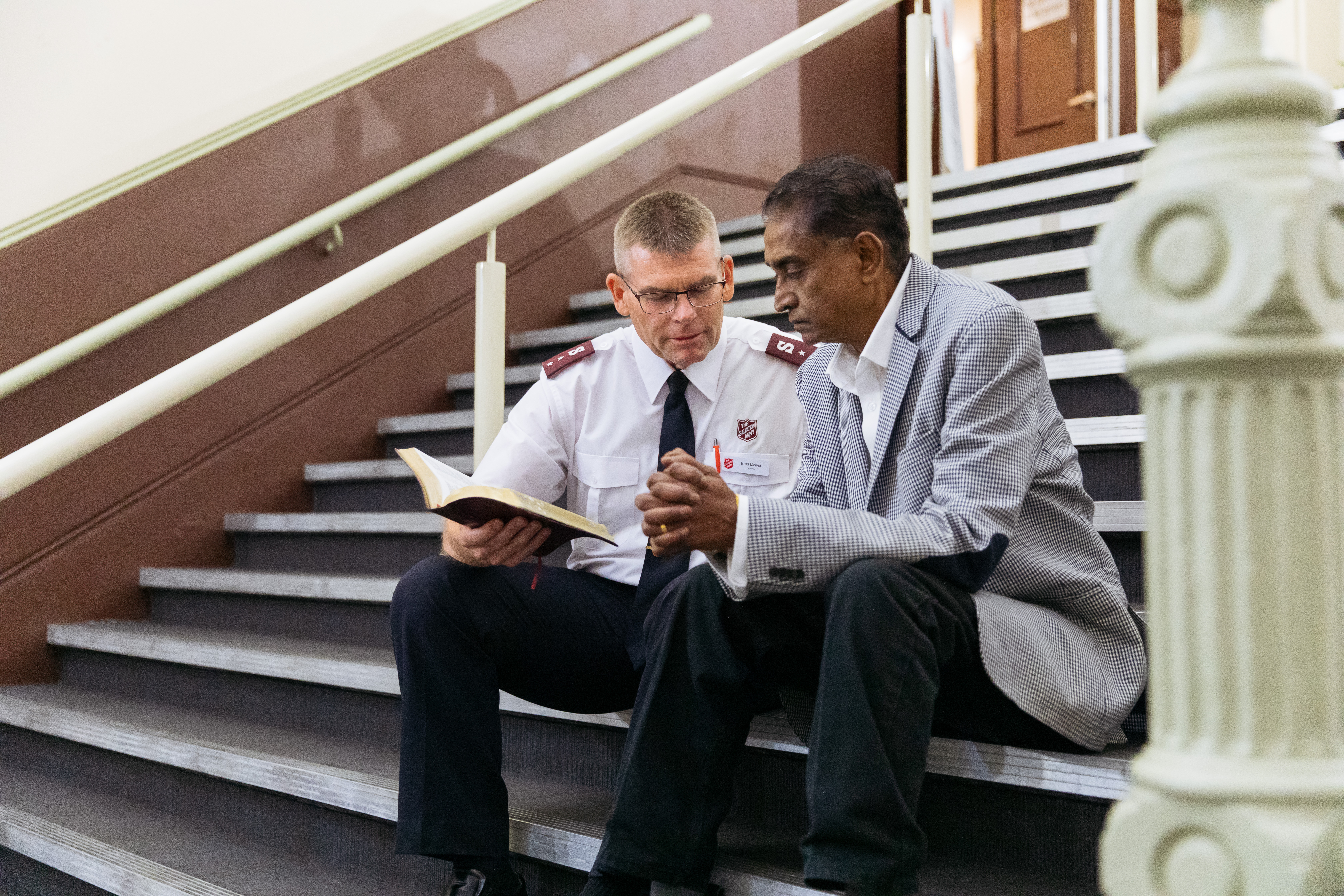 Chaplain talking to elderly person
