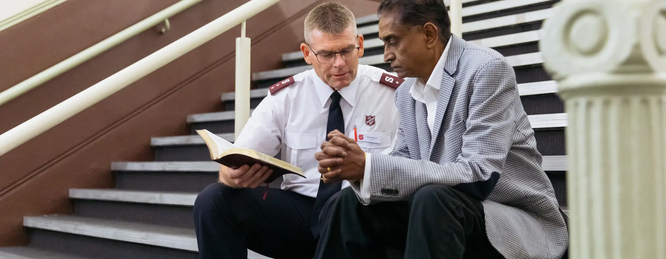 Chaplain talking to elderly person