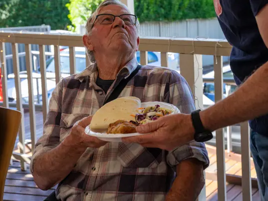 Man being served lunch
