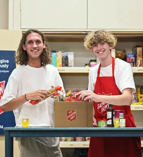 Salvos preparing a food hamper for those in need.
