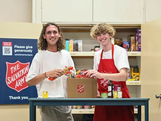 Salvos preparing a food hamper for those in need.