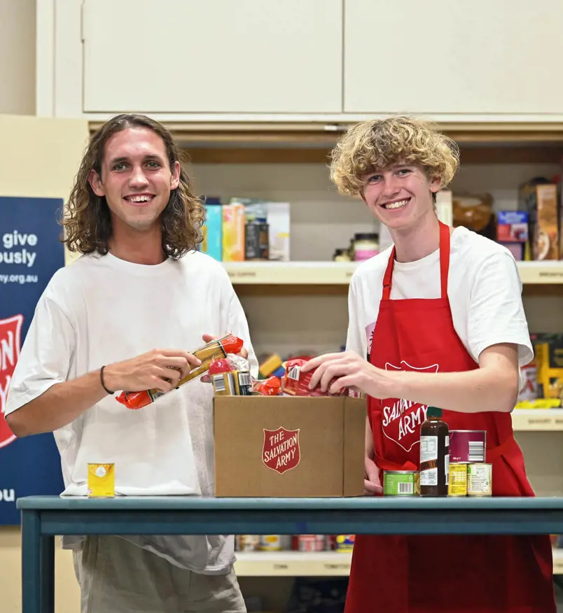 Salvos preparing a food hamper for those in need.