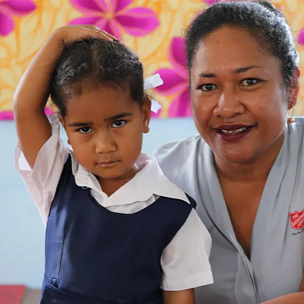 Female teacher and girl student side-by-side