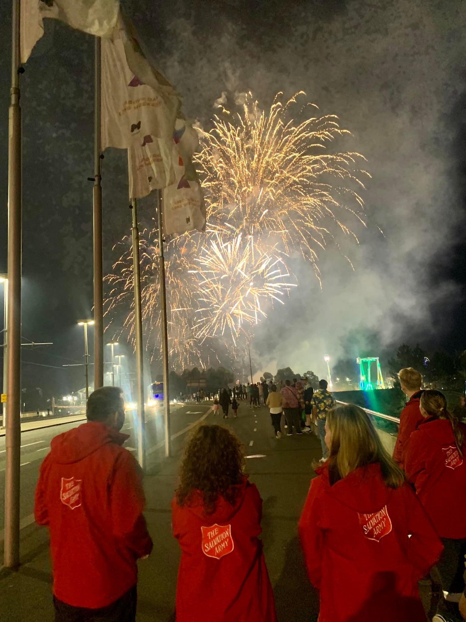 Melbourne Street team walking at night looking at fireworks