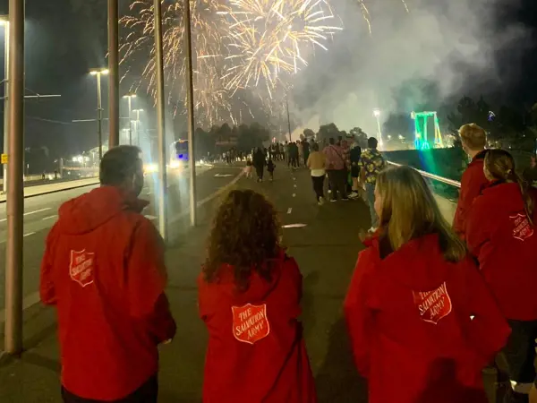 Melbourne Street team walking at night looking at fireworks