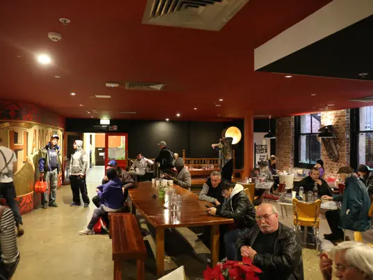 People sitting in the main cafe area