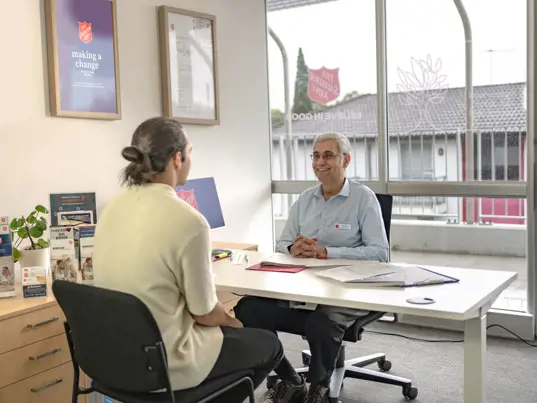 Young man talking to Moneycare Financial Counsellor