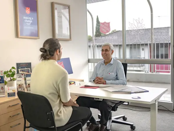 Young man talking to Moneycare Financial Counsellor