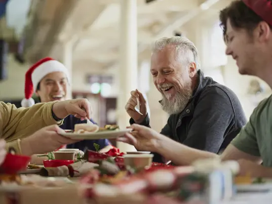 friends sharing a Christmas meal