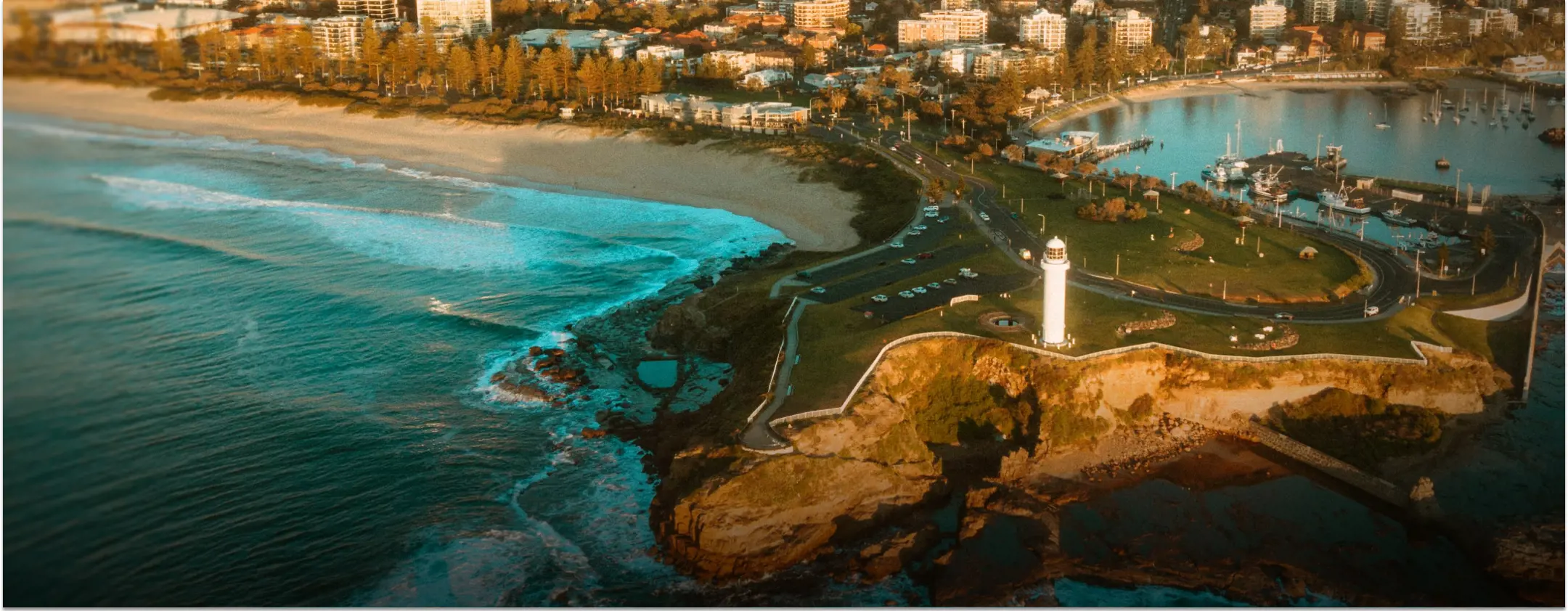 Wollongong, NSW: A breathtaking aerial view of a city coastline