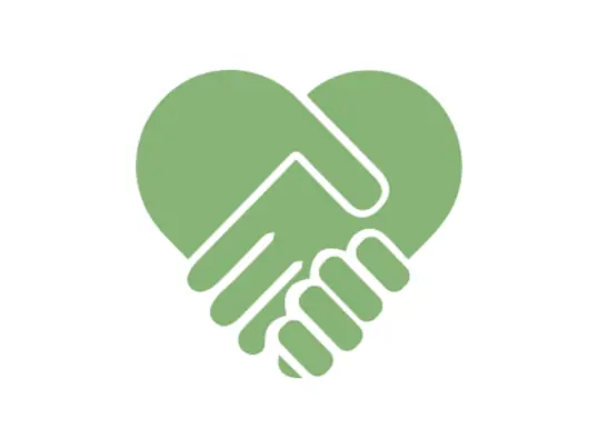Two hands clasp in a handshake creating a heart shape in silhouette