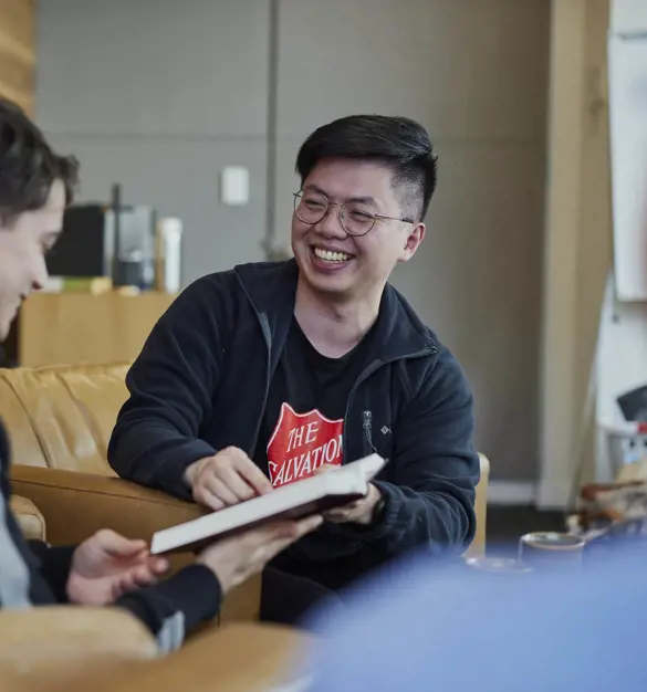 Volunteer smiling with young person