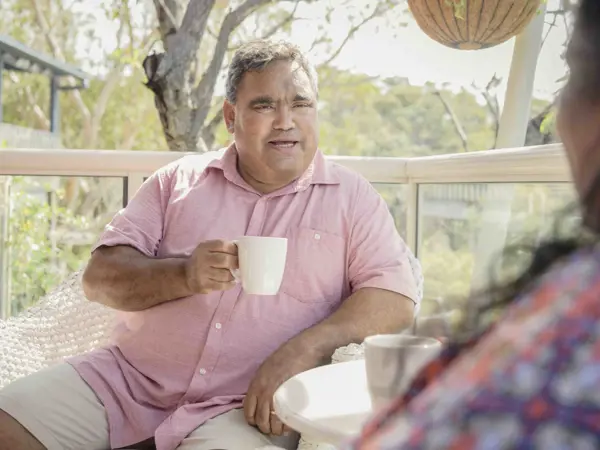 Man having a conversation over a cup of tea