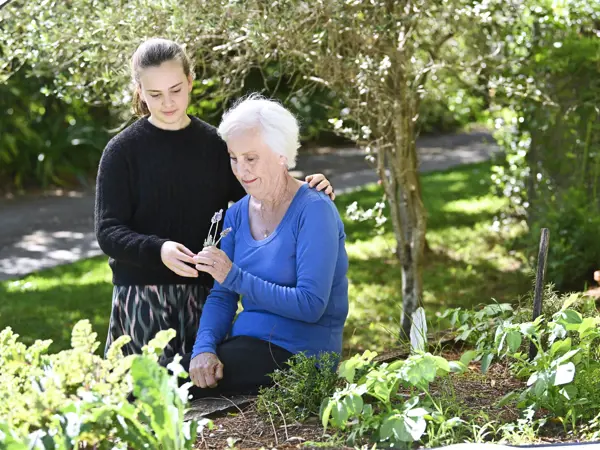 Grandmother and granddaughter spending a quiet moment together in the garden