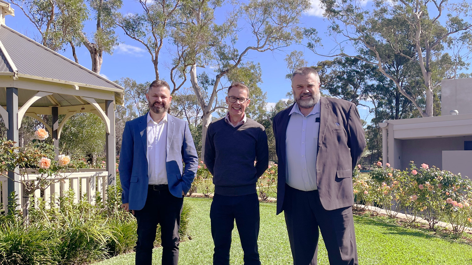 Three Salvos Funerals team members standing together outdoors in Perth