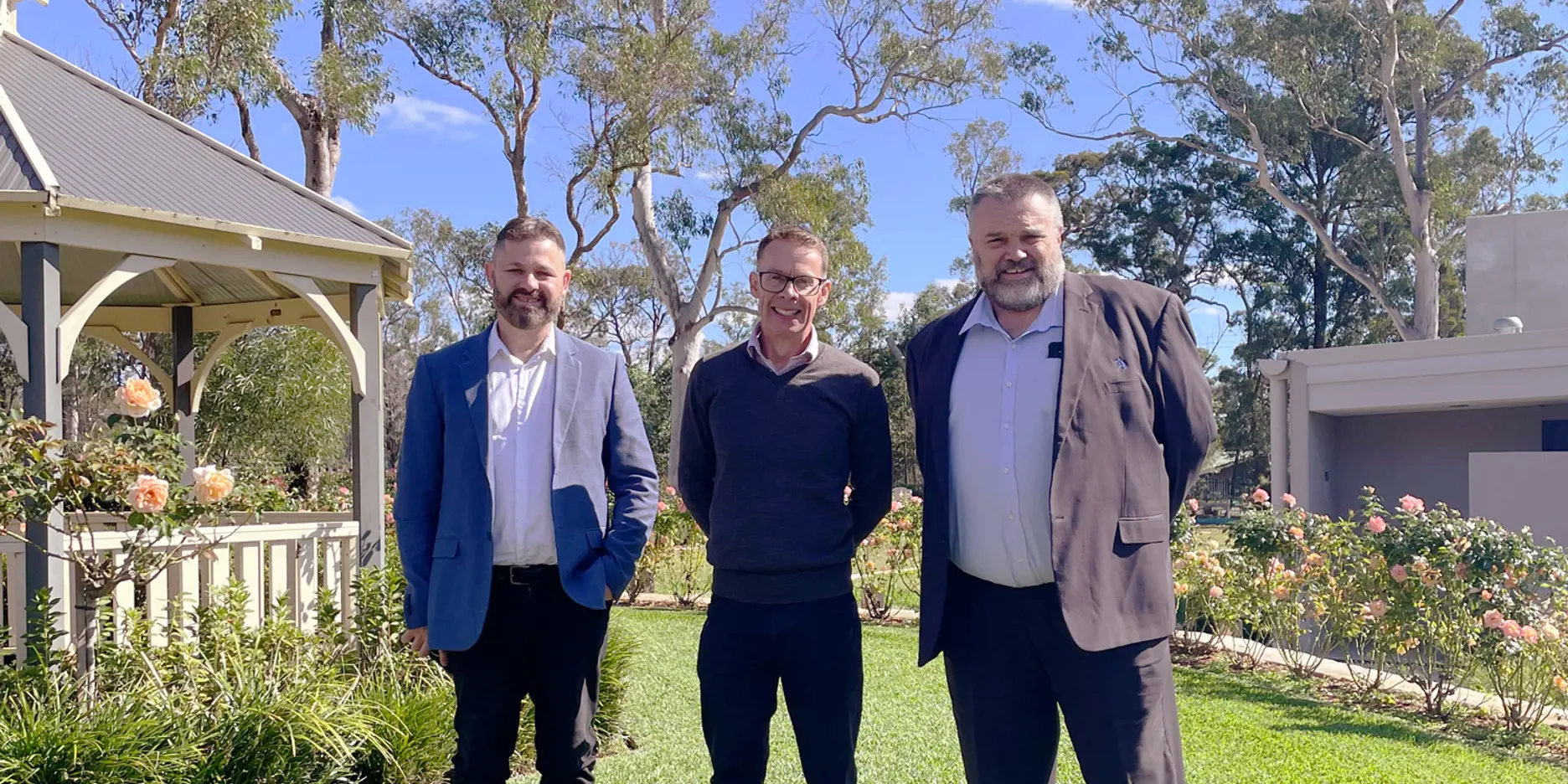 Three Salvos Funerals team members standing together outdoors in Perth